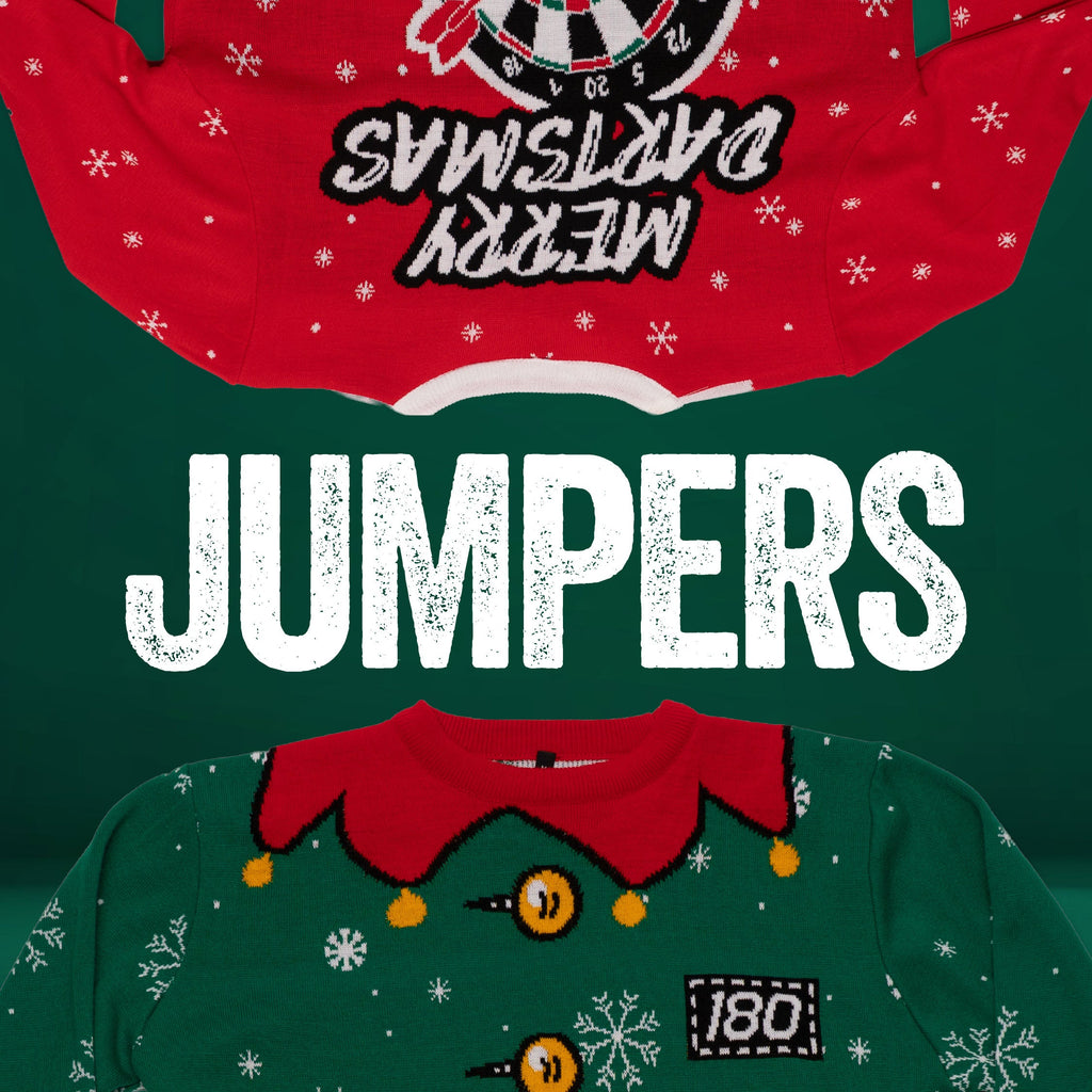 Two festive jumpers, one red with Merry Dartsmas upside down and one green with an elf design, displayed above and below the word JUMPERS in bold white letters on a green background.