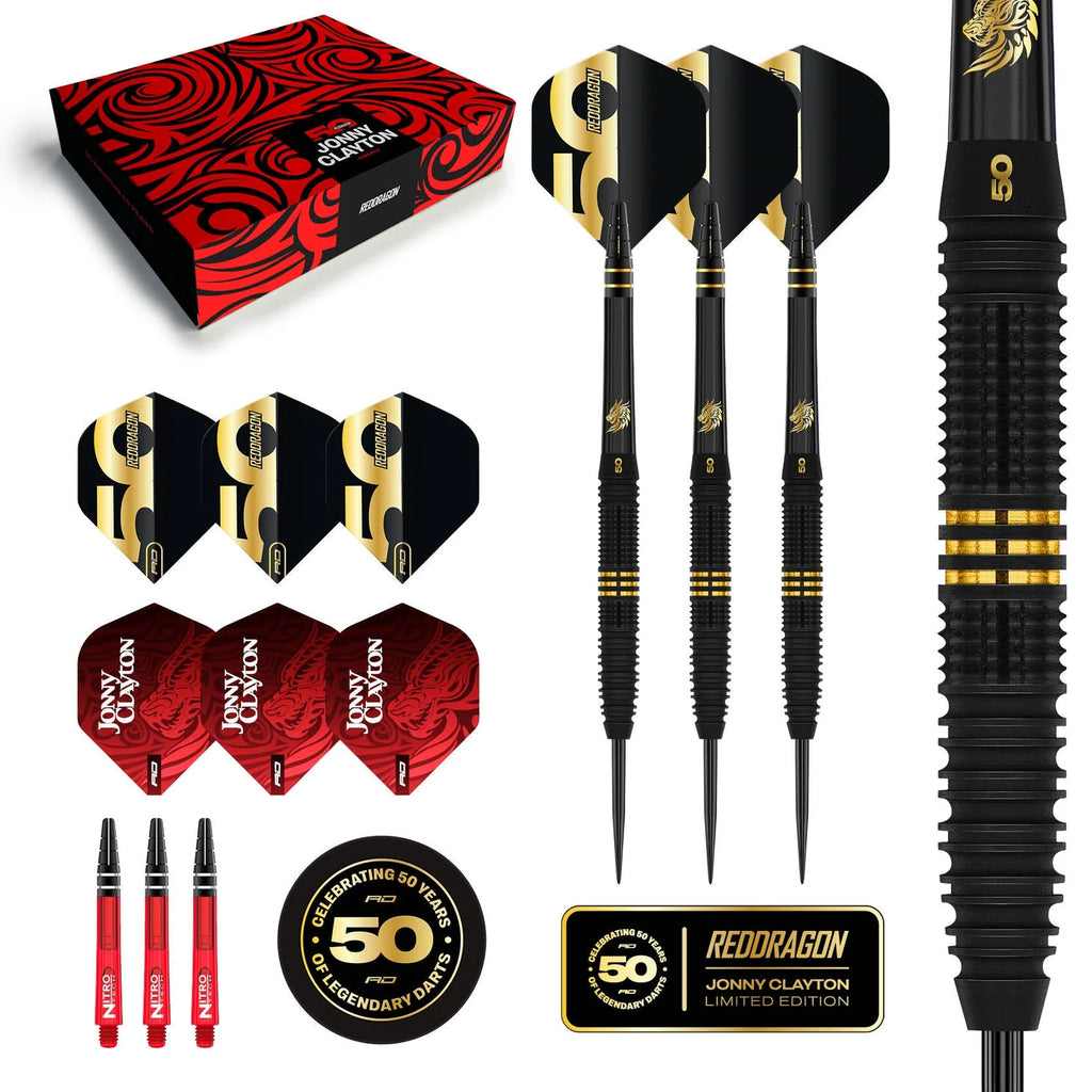The Jonny Clayton 50 Year Player Edition Box by Professional Darts Corporation includes three 90% tungsten black and gold darts, extra flights, red stems, a dragon-embossed box, and a Celebrating 50 Years badge.