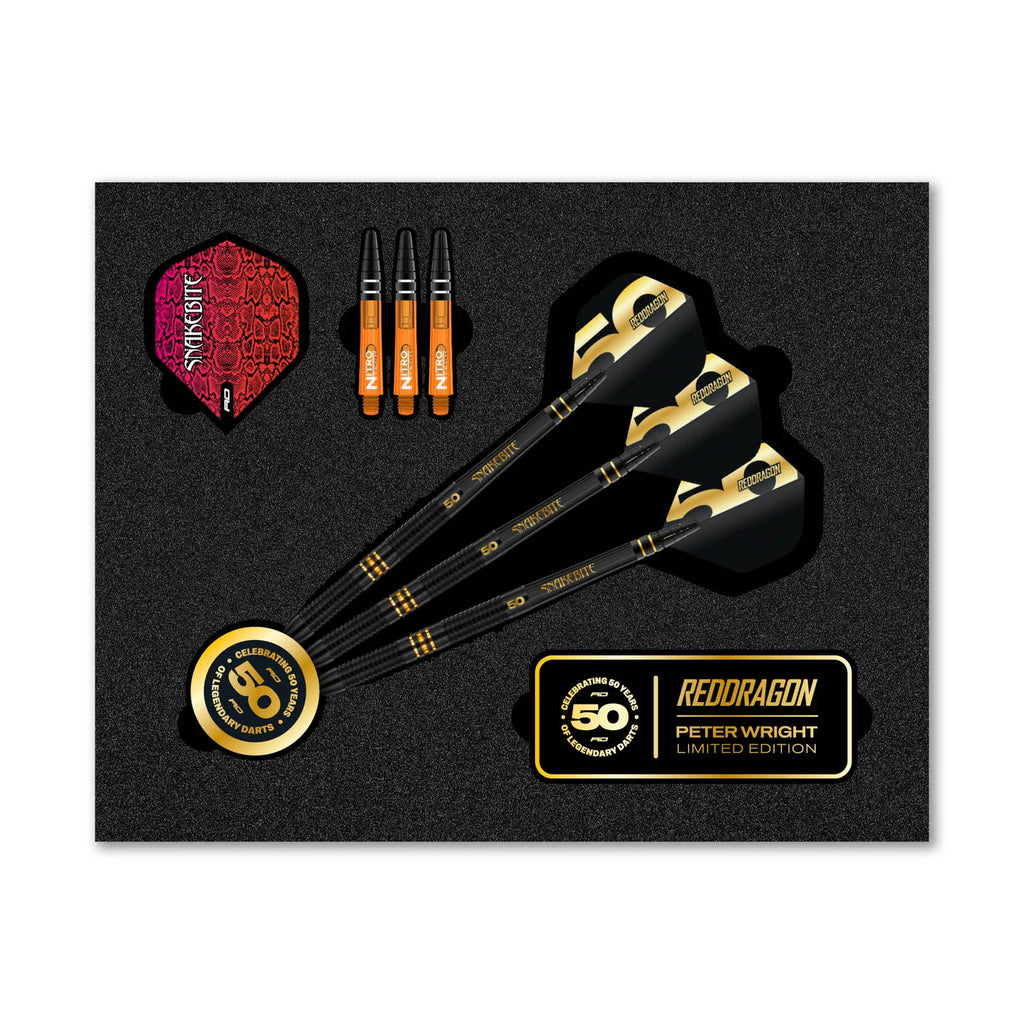 The Professional Darts Corporation Peter Wright 50 Year Player Edition Box includes three black and gold darts, three orange replacement shafts, dart flights, and a gold 50th anniversary coin in a sleek black presentation.
