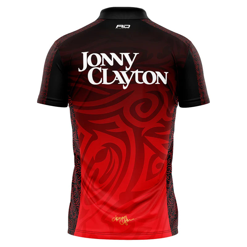 Celebrate darts legend Jonny Clayton with the Professional Darts Corporation’s Jonny Clayton 50 Year Player Edition Shirt, featuring a black and red tribal Welsh dragon design and bold “Jonny Clayton” lettering on the back.